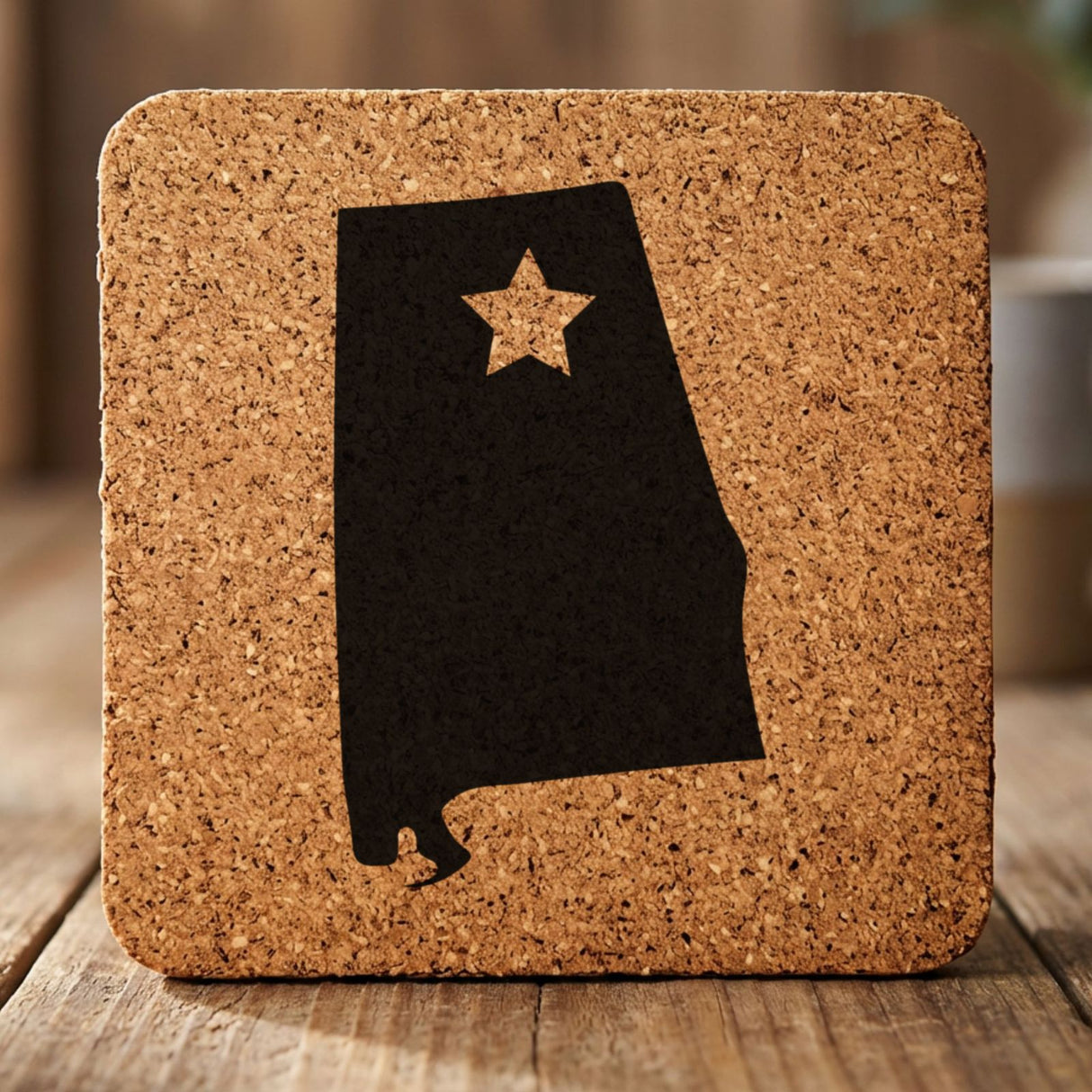 Alabama square cork coaster engraved with the state shape and a star
