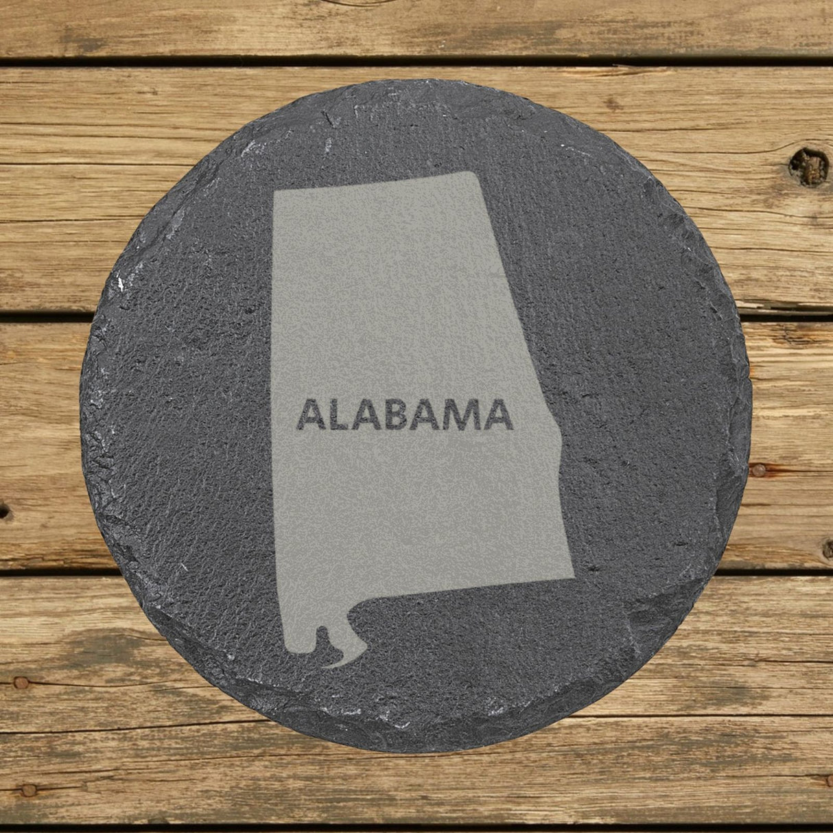 Alabama round slate coaster engraved with the state shape and ALABAMA in bold lettering