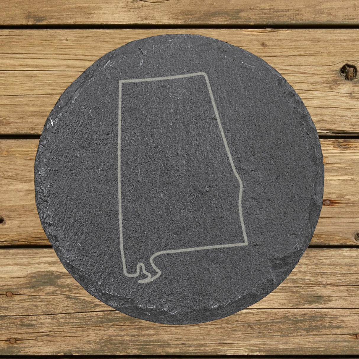 Alabama round slate coaster engraved with a clean state outline
