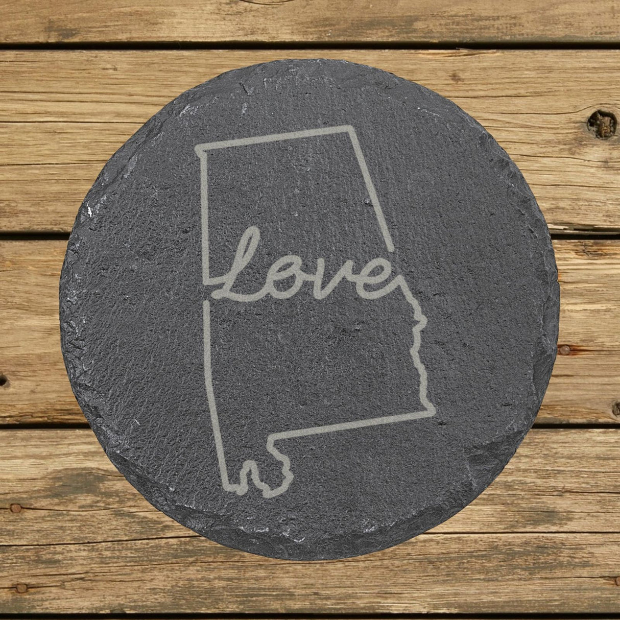 Alabama round slate coaster engraved with a hand-drawn state outline and love in cursive