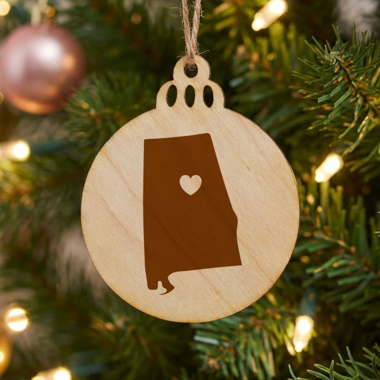 Alabama round wood Christmas ornament engraved with the state shape and a heart