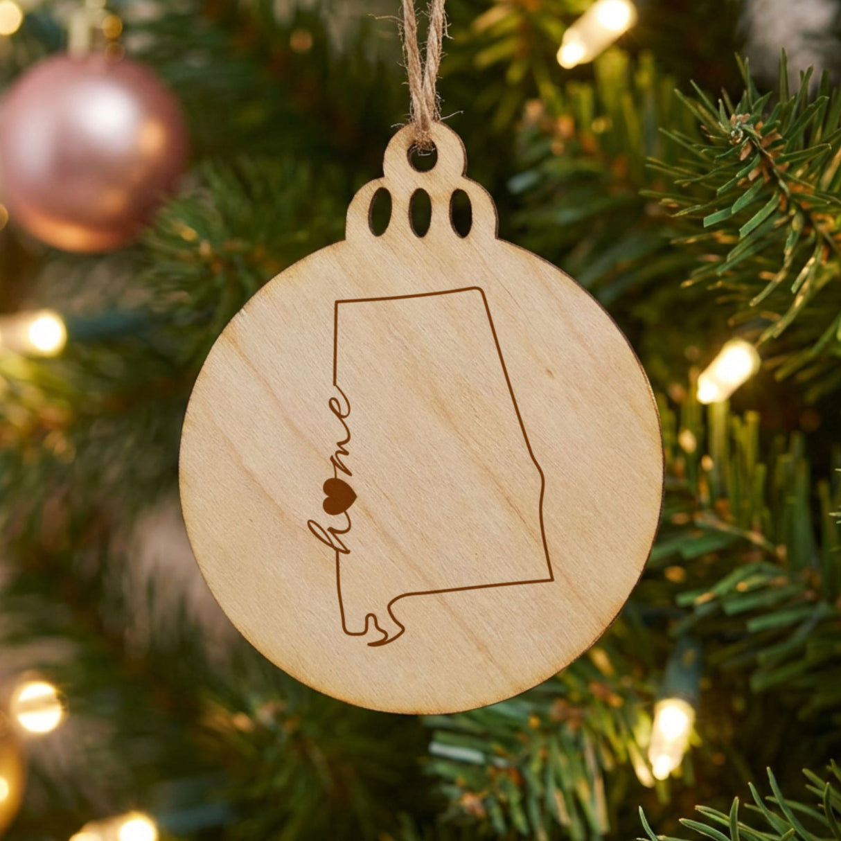 Alabama round wood Christmas ornament engraved with the state outline and home in script with a heart