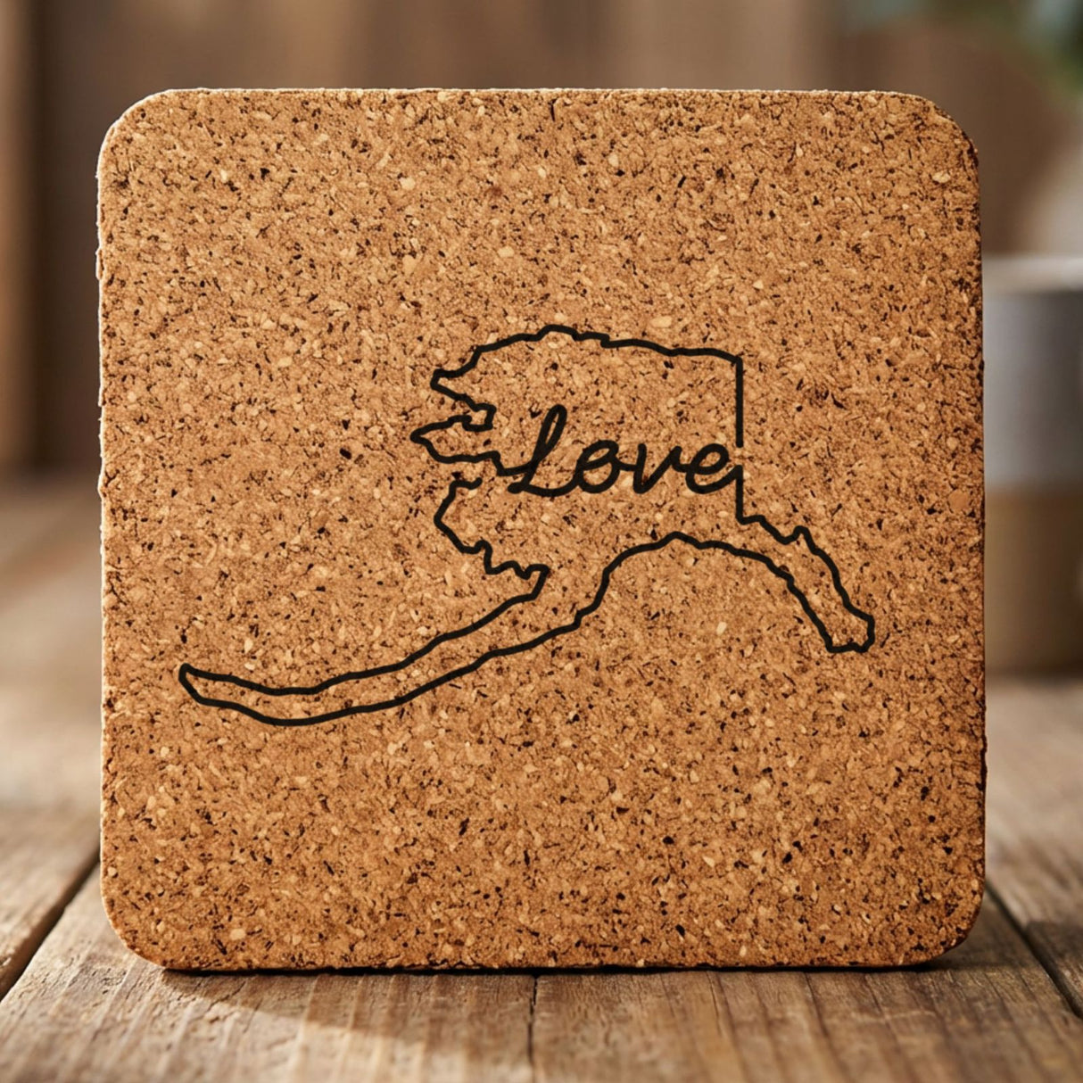 Alaska square cork coaster engraved with a hand-drawn state outline and love in cursive