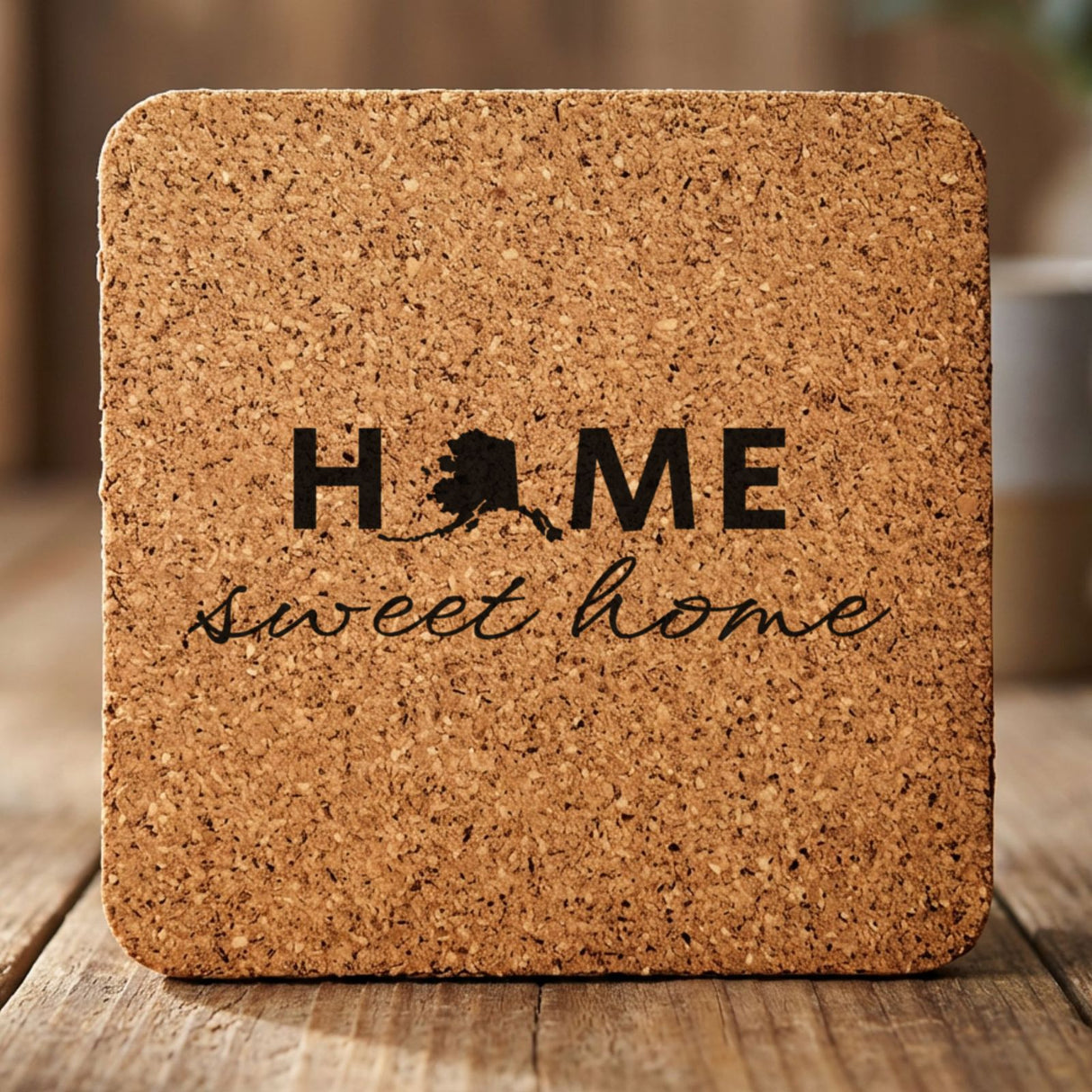 Alaska square cork coaster engraved with HOME sweet home using the state shape as the letter O