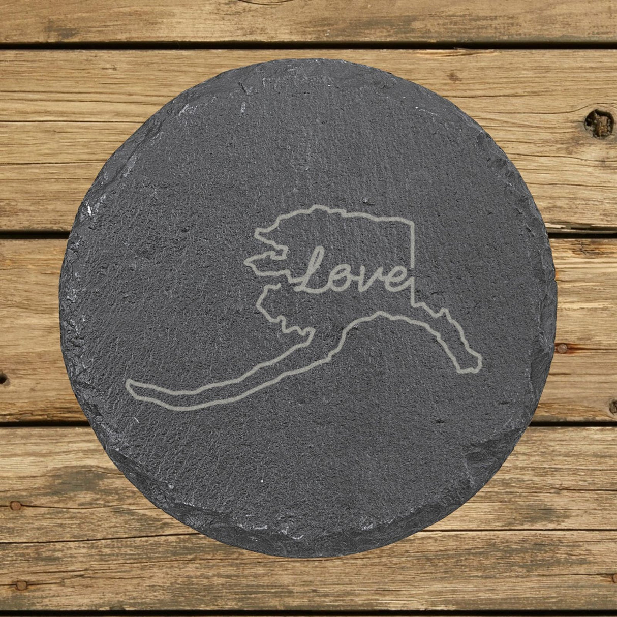 Alaska round slate coaster engraved with a hand-drawn state outline and love in cursive