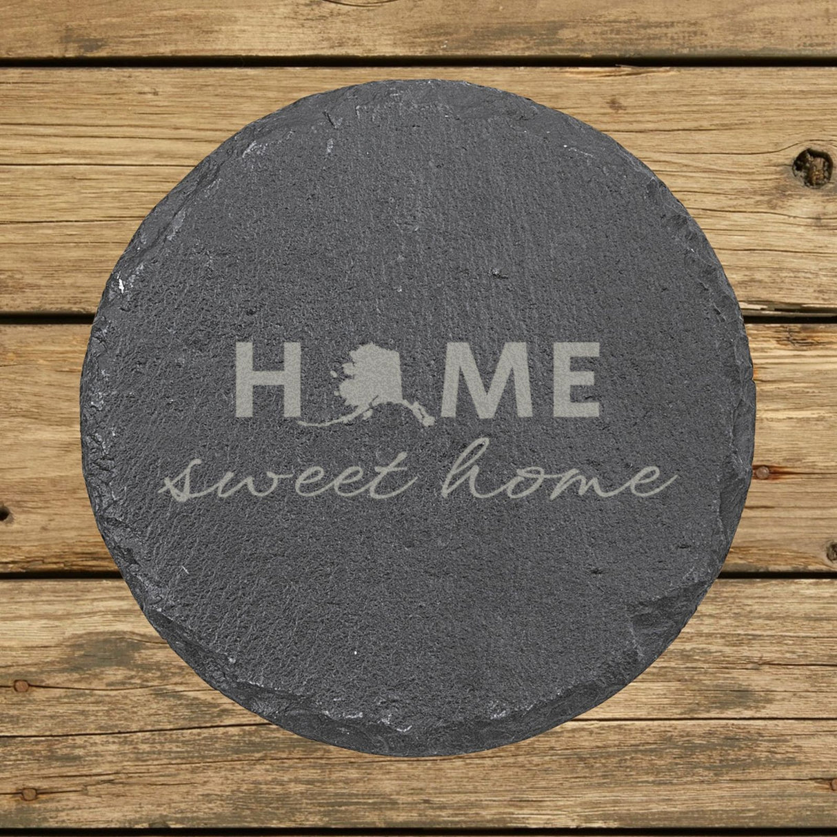Alaska round slate coaster engraved with HOME sweet home using the state shape as the letter O
