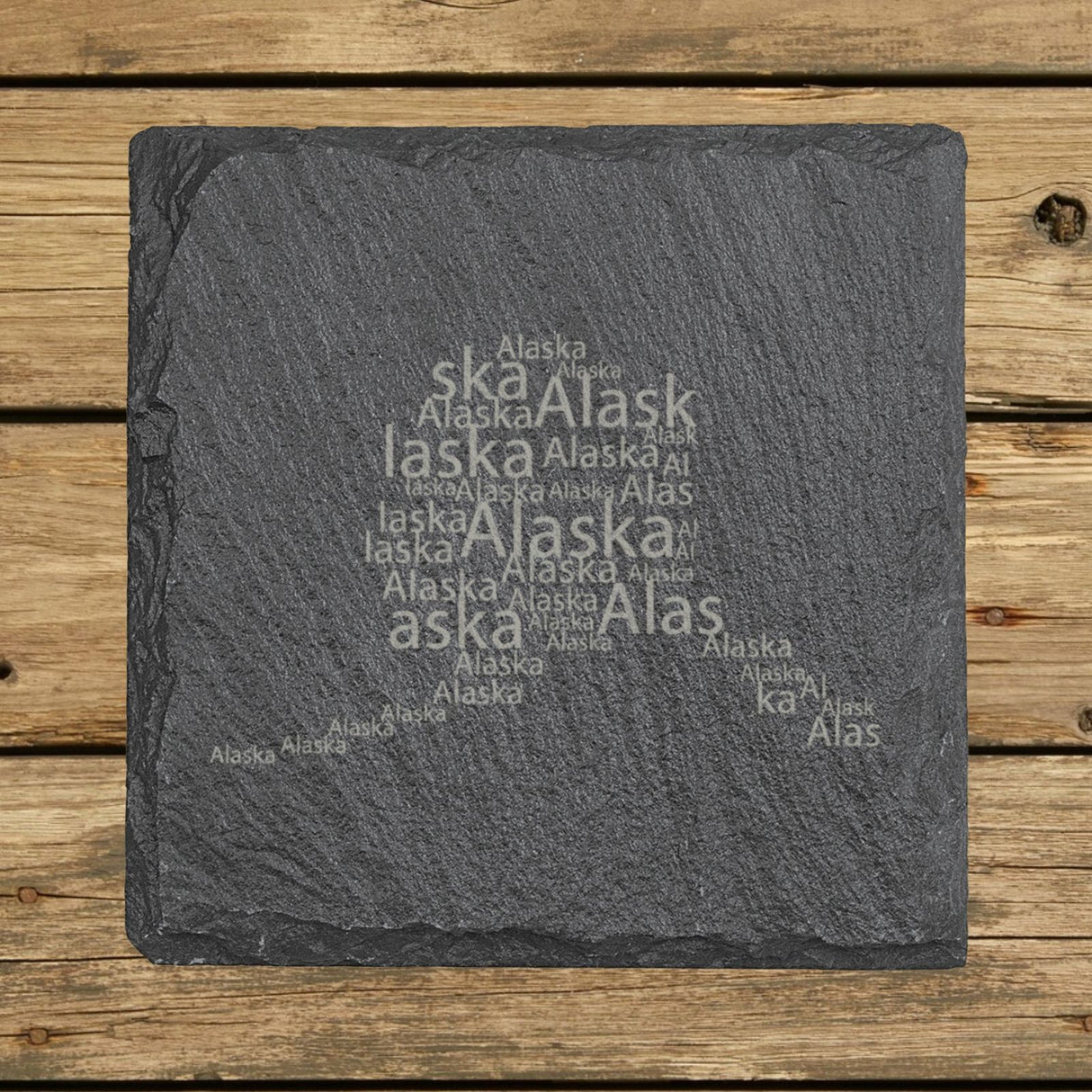 Alaska square slate coaster engraved with a word cloud of repeating Alaska text