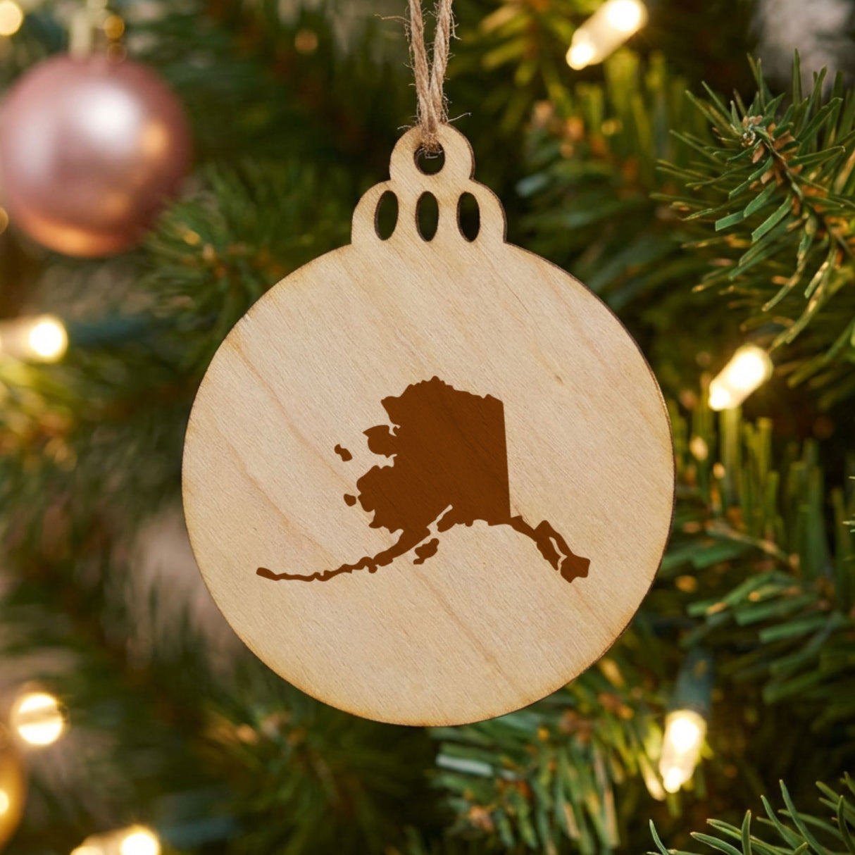Alaska round wood Christmas ornament with the full state shape engraved