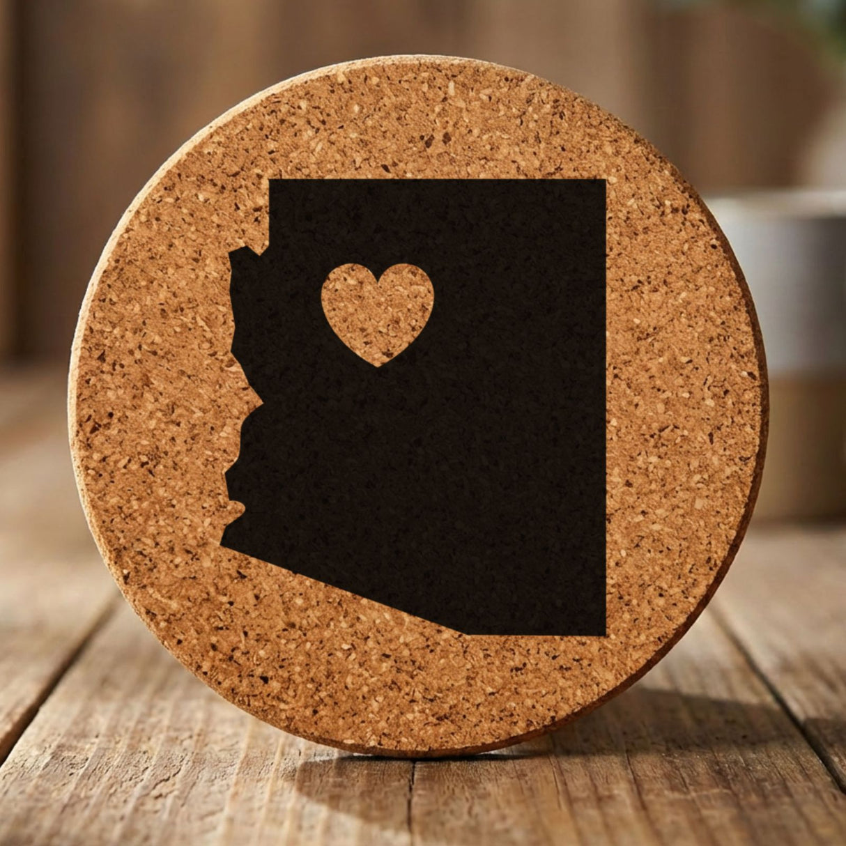 Arizona round cork coaster engraved with the state shape and a heart