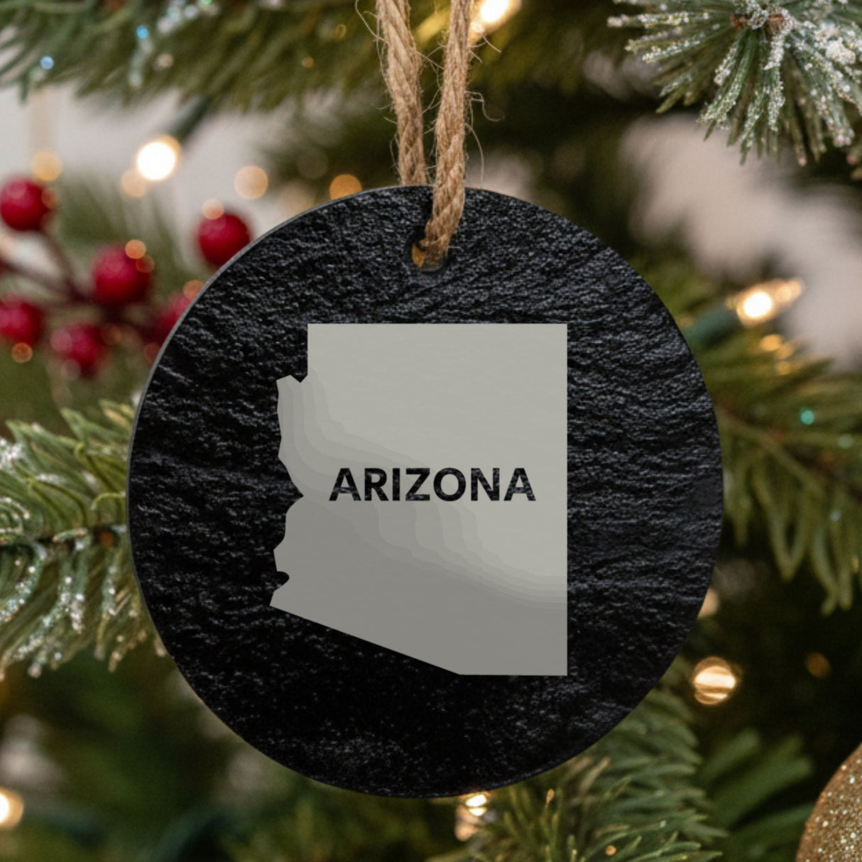 Arizona round slate Christmas ornament engraved with the state shape and ARIZONA in bold lettering