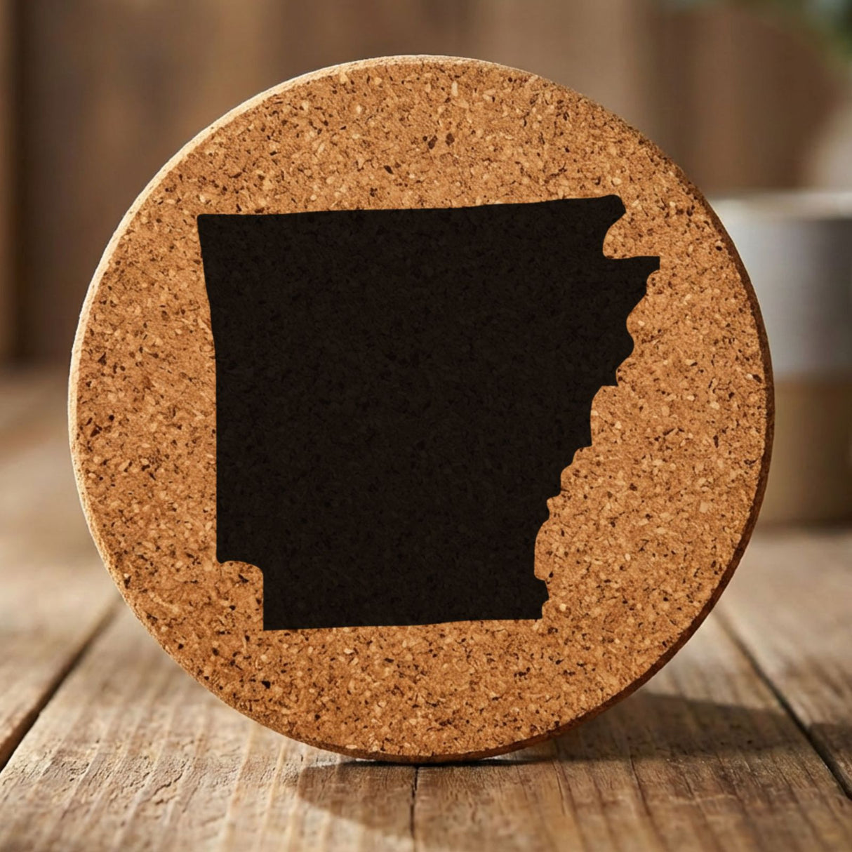 Arkansas round cork coaster with the full state shape engraved