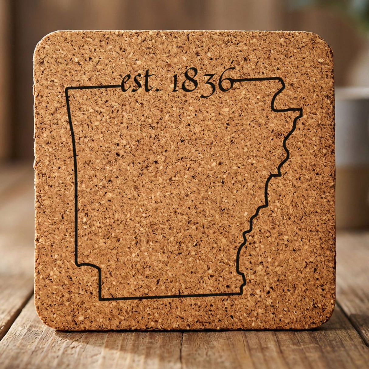 Arkansas square cork coaster engraved with the state outline and est. 1836