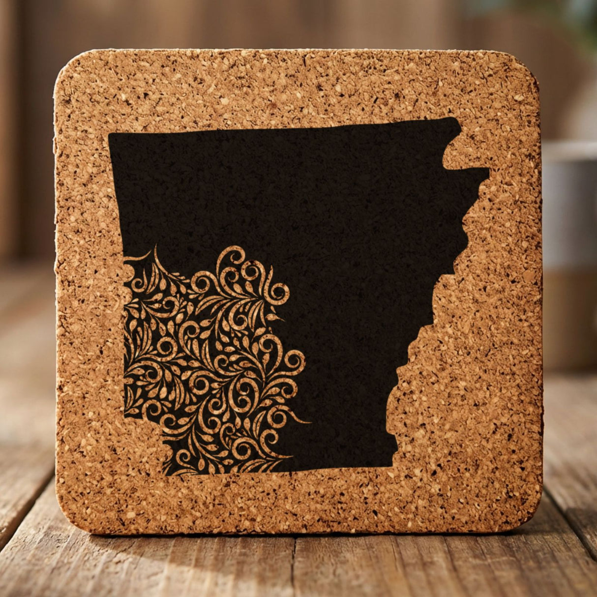 Arkansas square cork coaster engraved with the state shape in ornate floral scrollwork