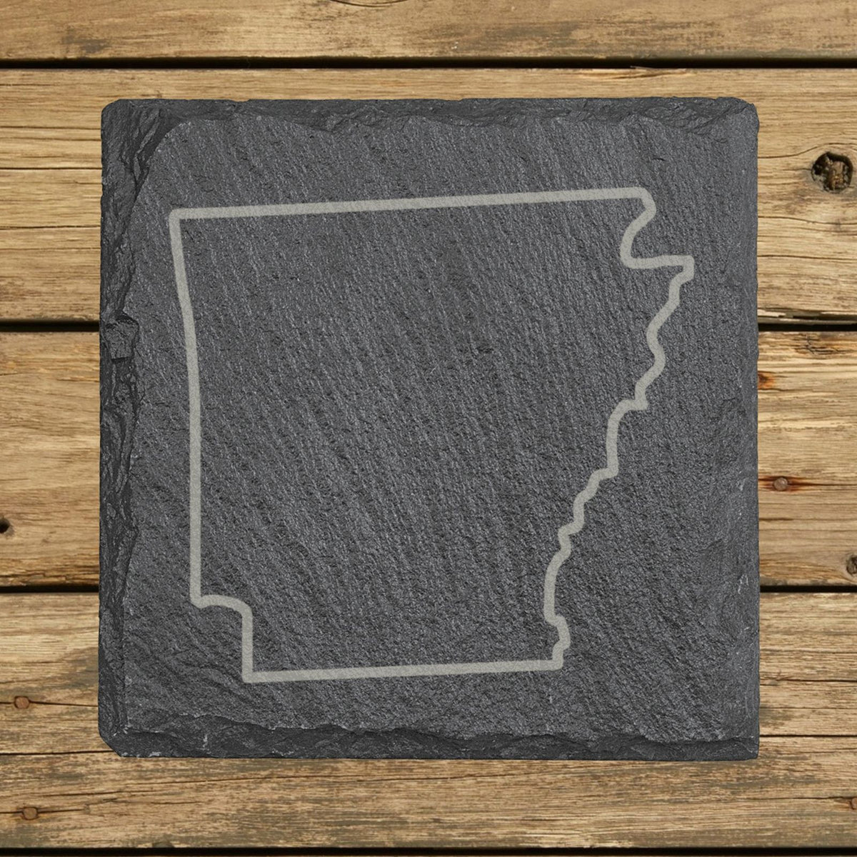 Arkansas square slate coaster engraved with a clean state outline
