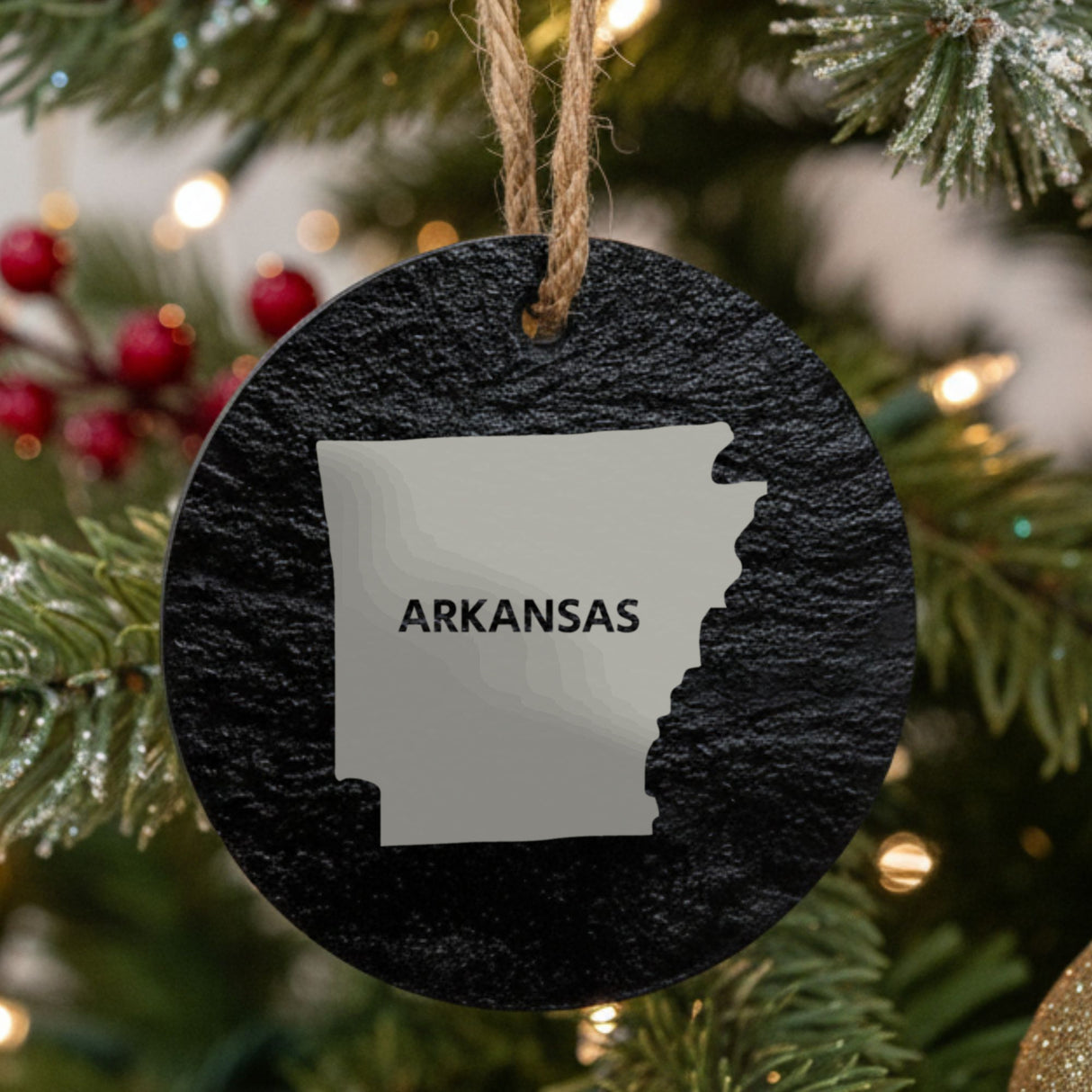 Arkansas round slate Christmas ornament engraved with the state shape and ARKANSAS in bold lettering