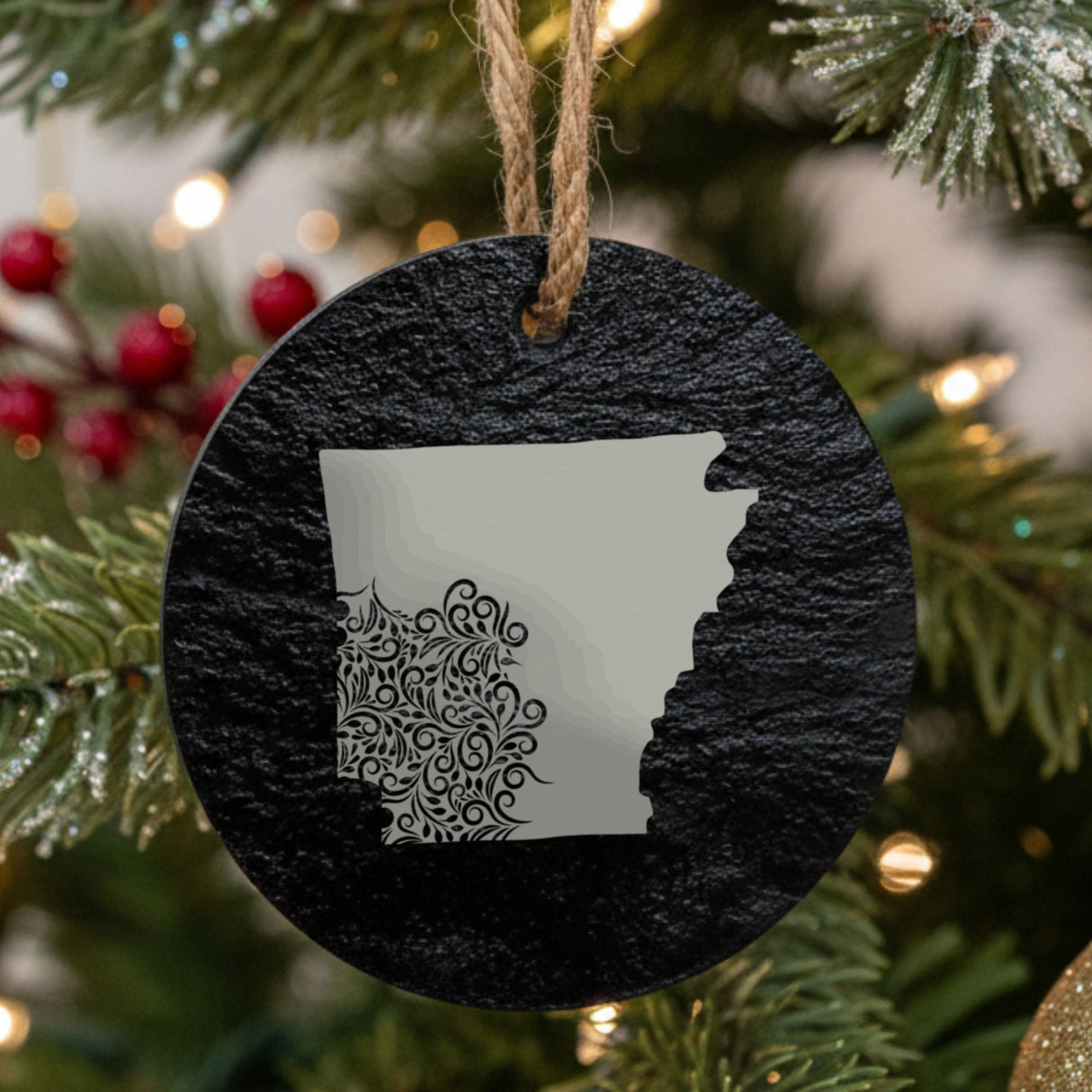 Arkansas round slate Christmas ornament engraved with the state shape in ornate floral scrollwork