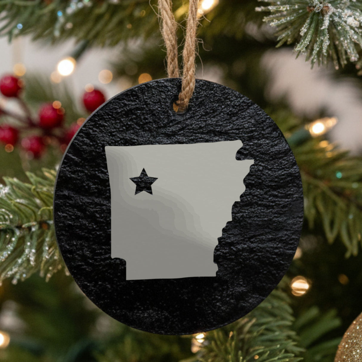 Arkansas round slate Christmas ornament engraved with the state shape and a star
