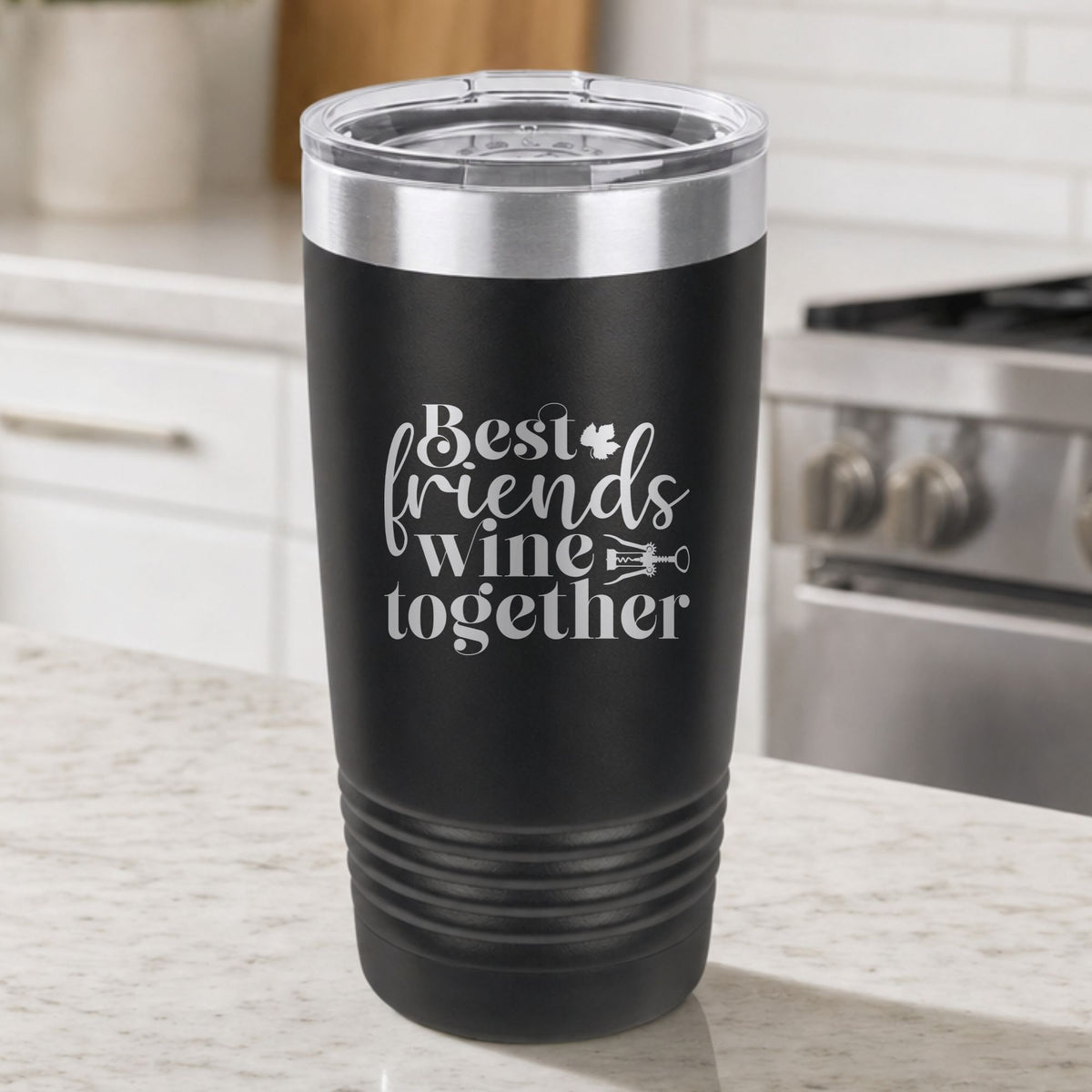 Black 20 oz tumbler laser engraved with "Best Friends Wine Together", on a kitchen counter