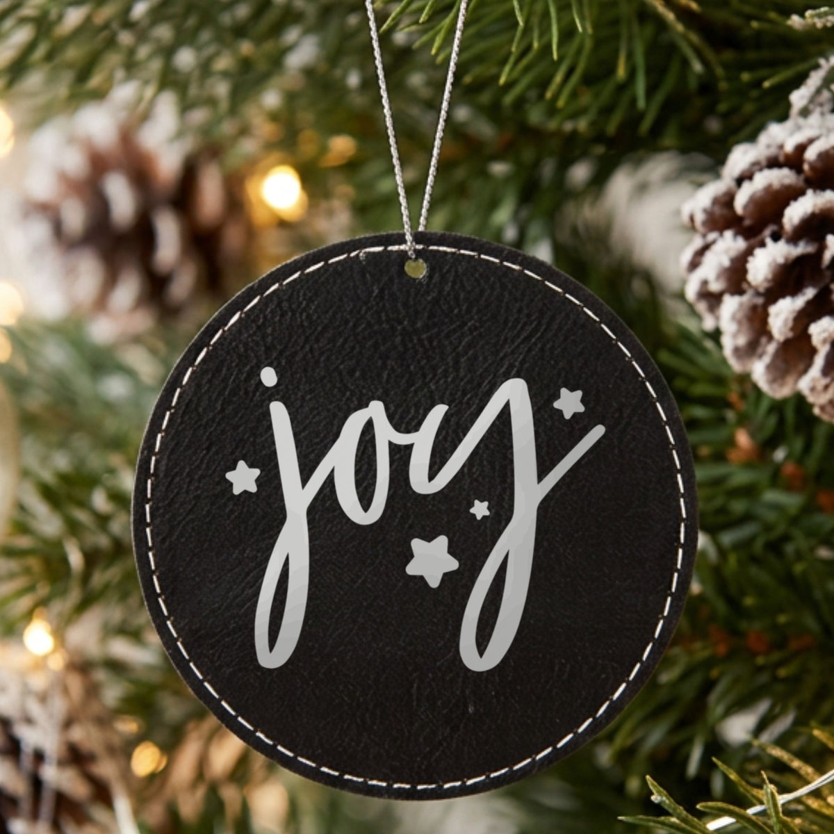 Black leatherette Christmas ornament engraved with Joy