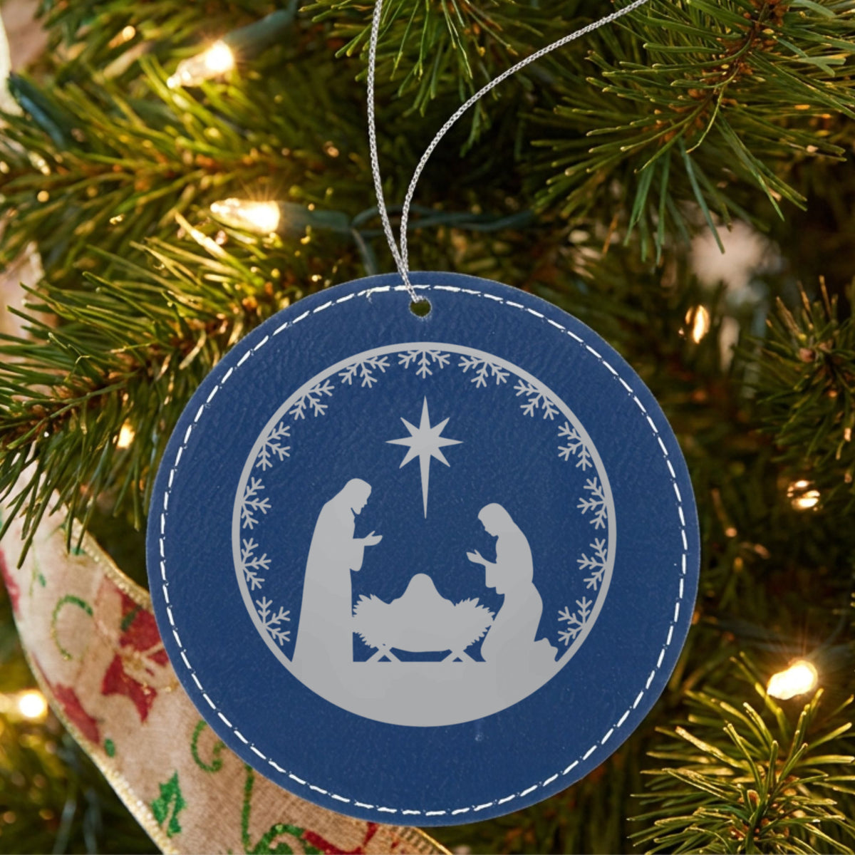 Blue leatherette Christmas ornament engraved with Nativity Scene, Round design