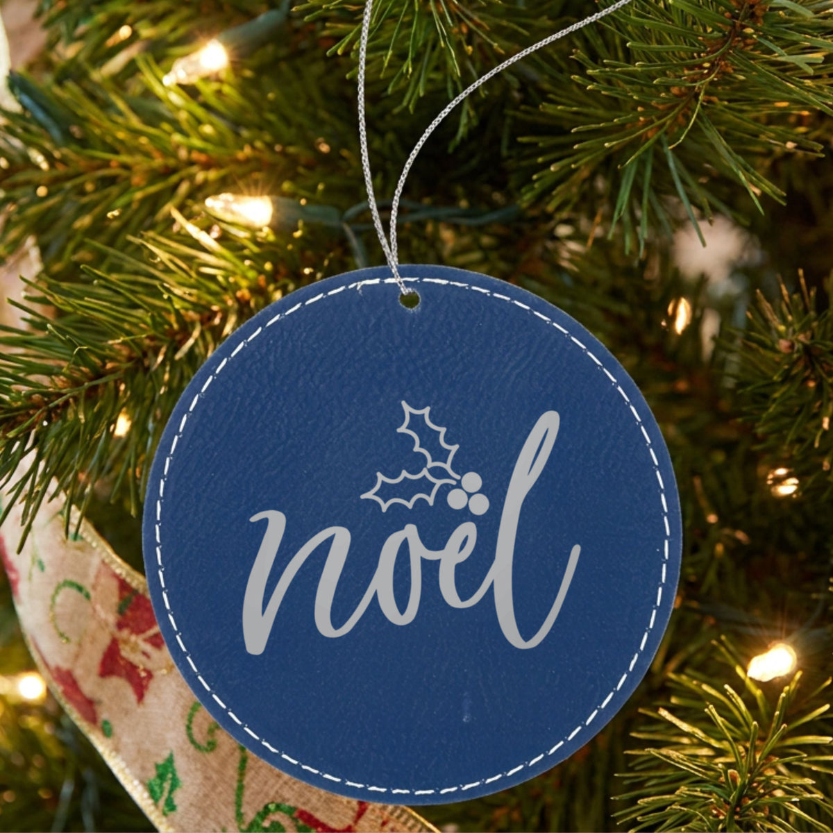 Blue leatherette Christmas ornament engraved with Noel
