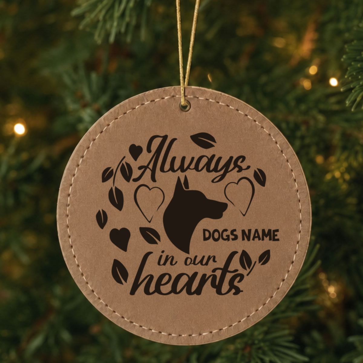 Brown leatherette Christmas ornament engraved with the Always in Our Hearts dog design