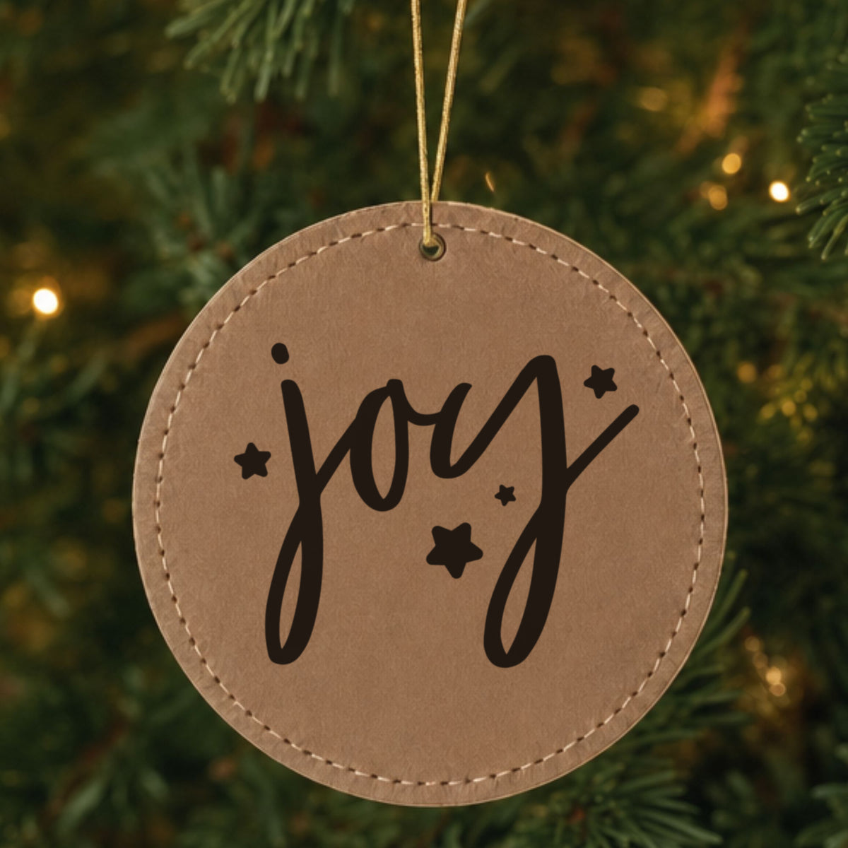 Brown leatherette Christmas ornament engraved with Joy