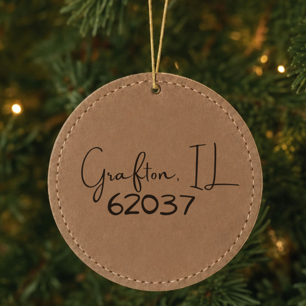 Brown leatherette Christmas ornament laser engraved with the Script City zip code design