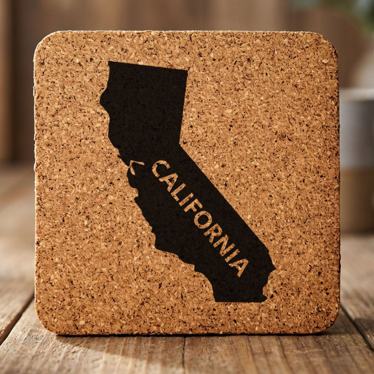 California square cork coaster engraved with the state shape and CALIFORNIA in bold lettering