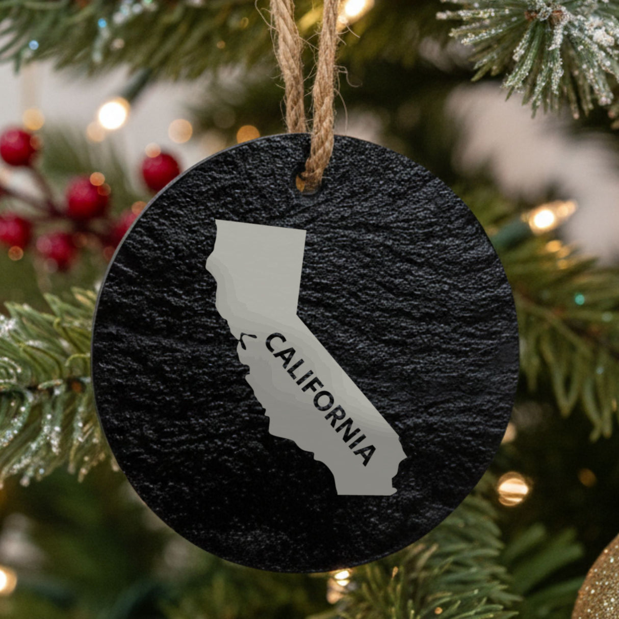 California round slate Christmas ornament engraved with the state shape and CALIFORNIA in bold lettering