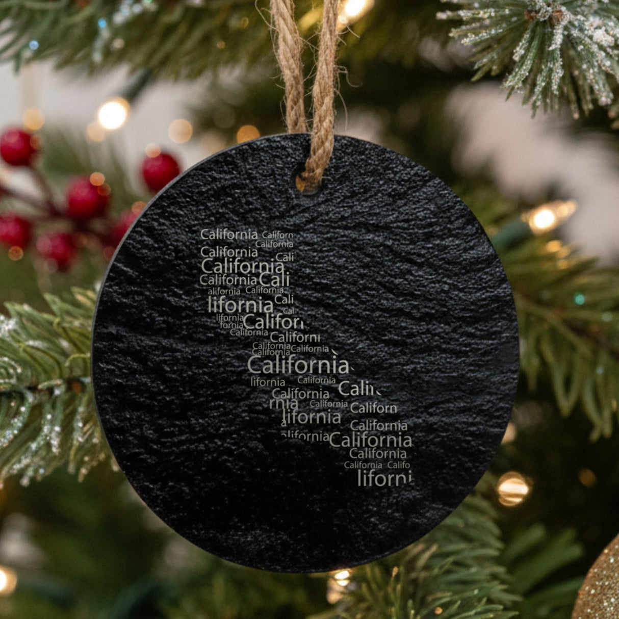 California round slate Christmas ornament engraved with a word cloud of repeating California text