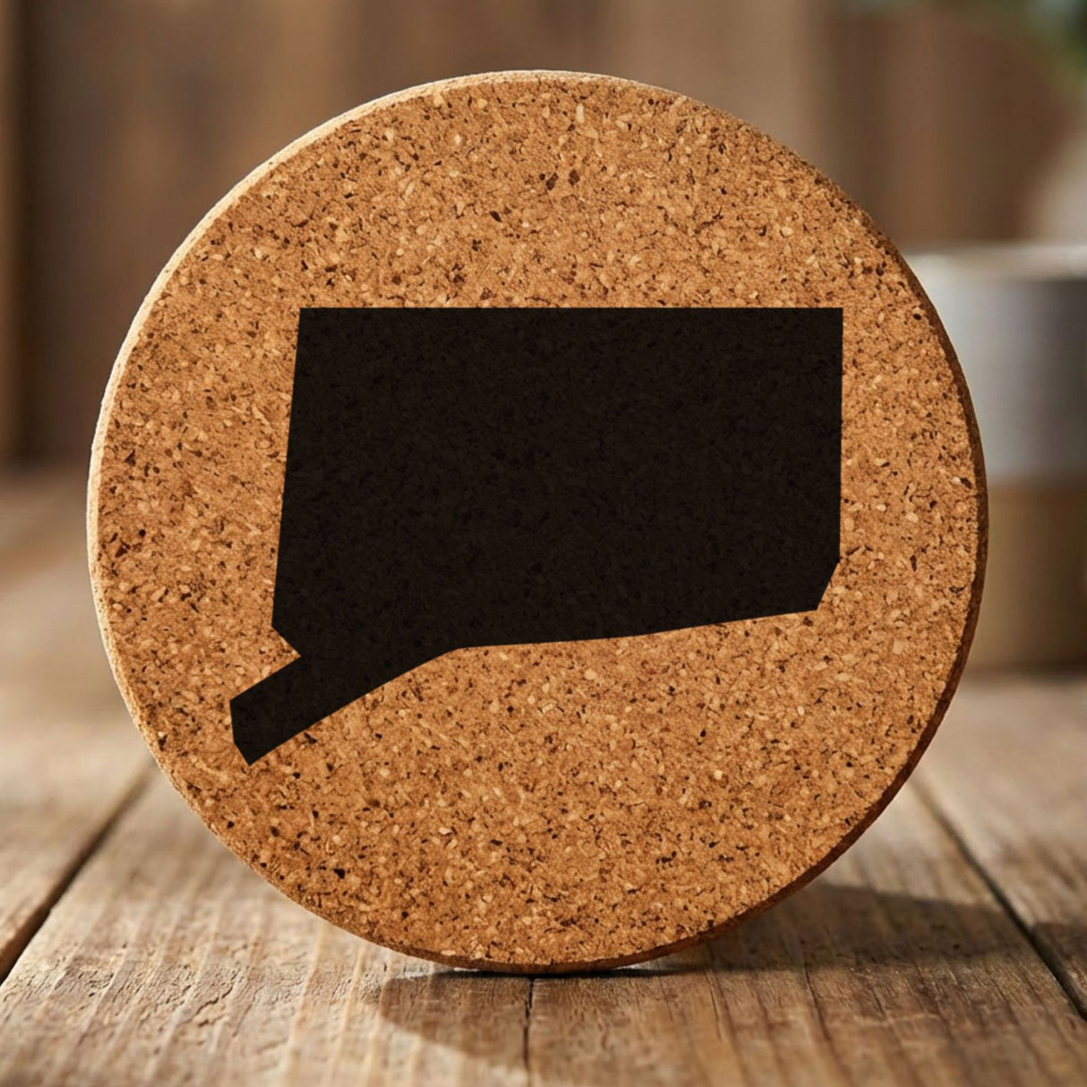 Connecticut round cork coaster with the full state shape engraved