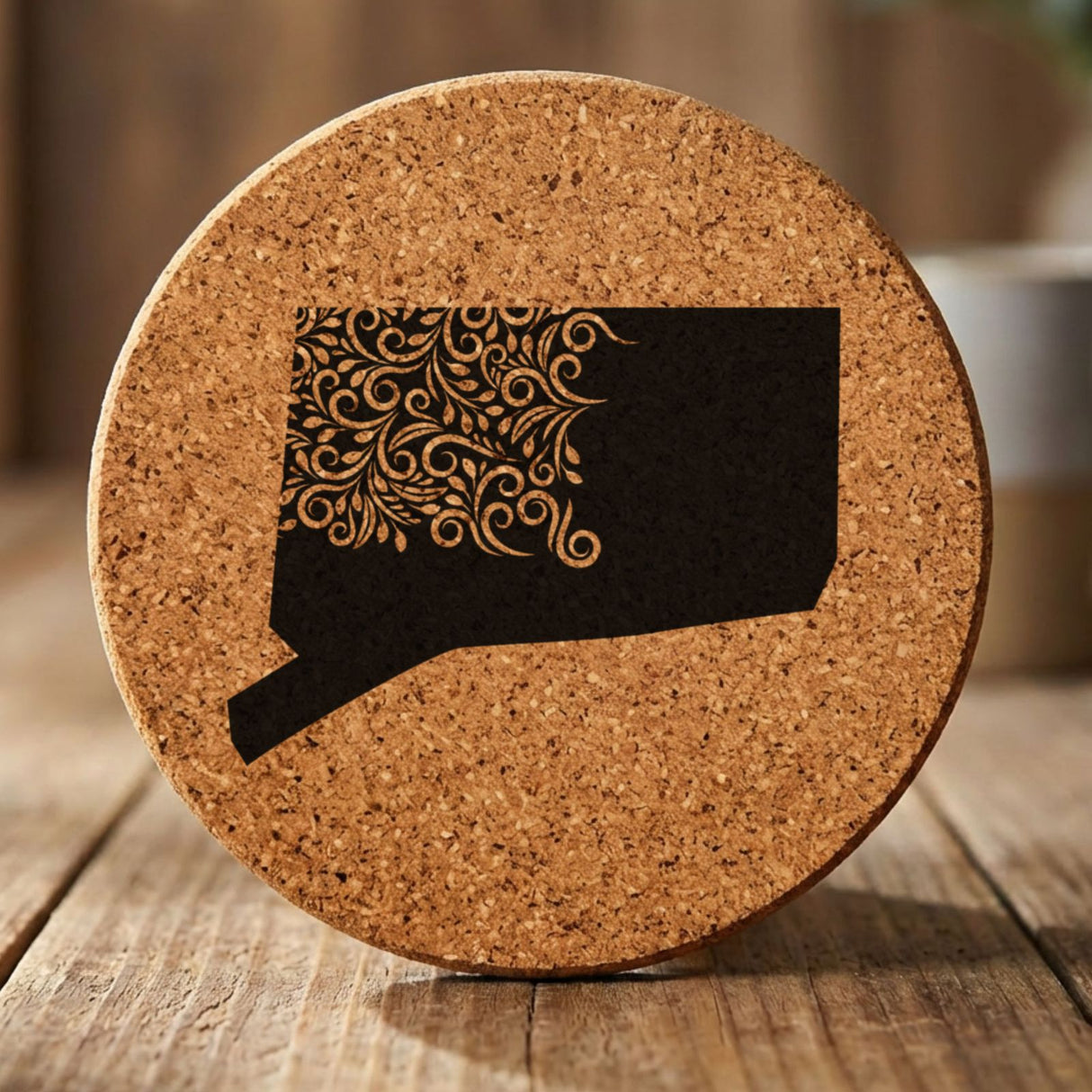 Connecticut round cork coaster engraved with the state shape in ornate floral scrollwork