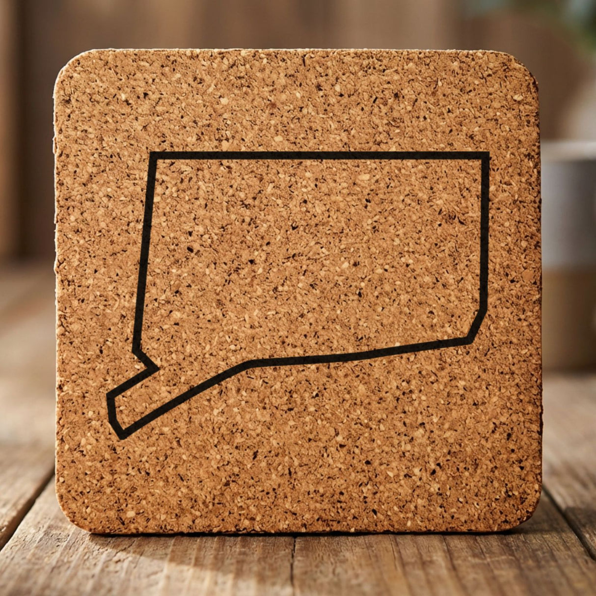 Connecticut square cork coaster engraved with a clean state outline