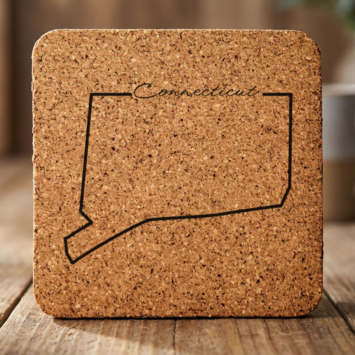 Connecticut square cork coaster engraved with the state outline and Connecticut in script lettering