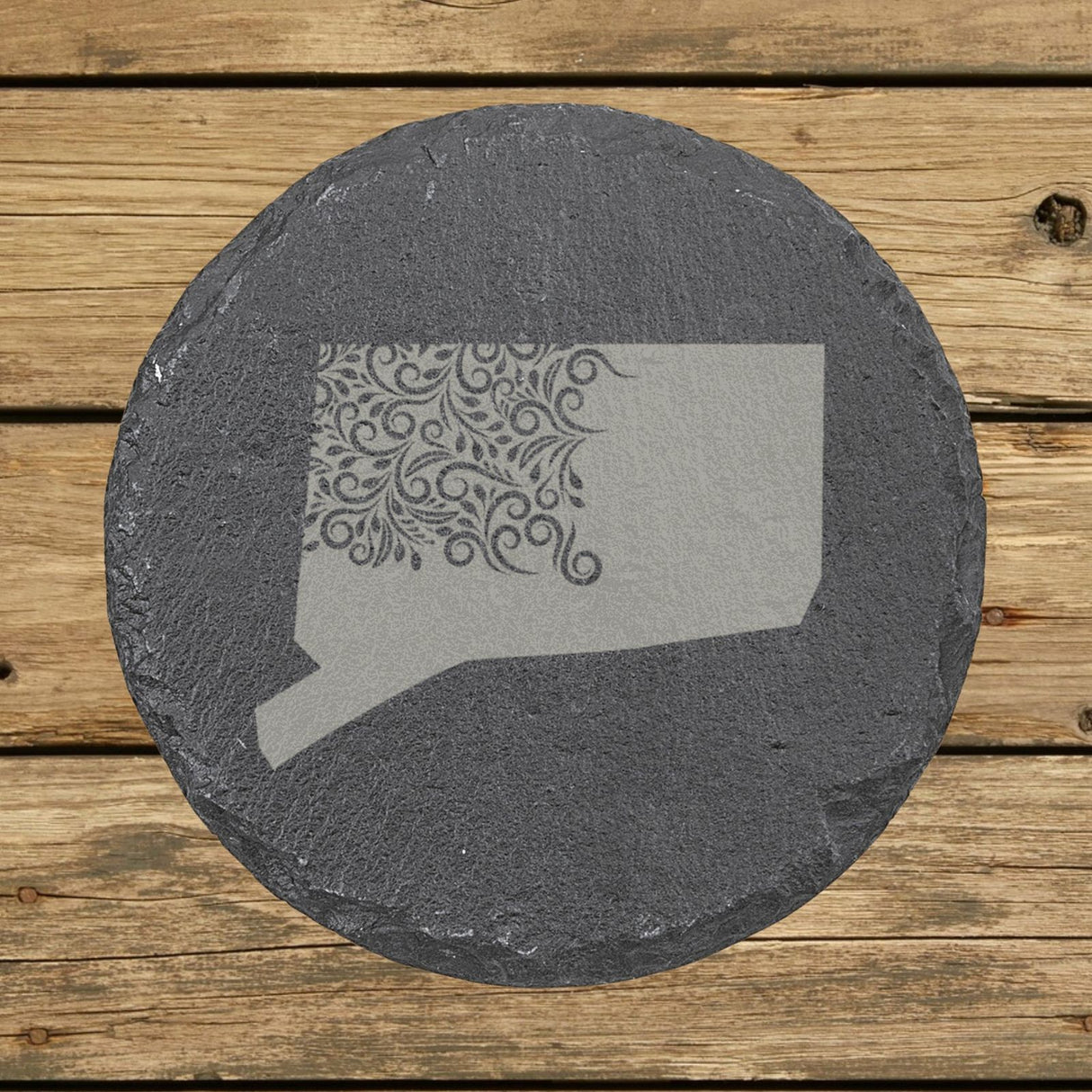 Connecticut round slate coaster engraved with the state shape in ornate floral scrollwork