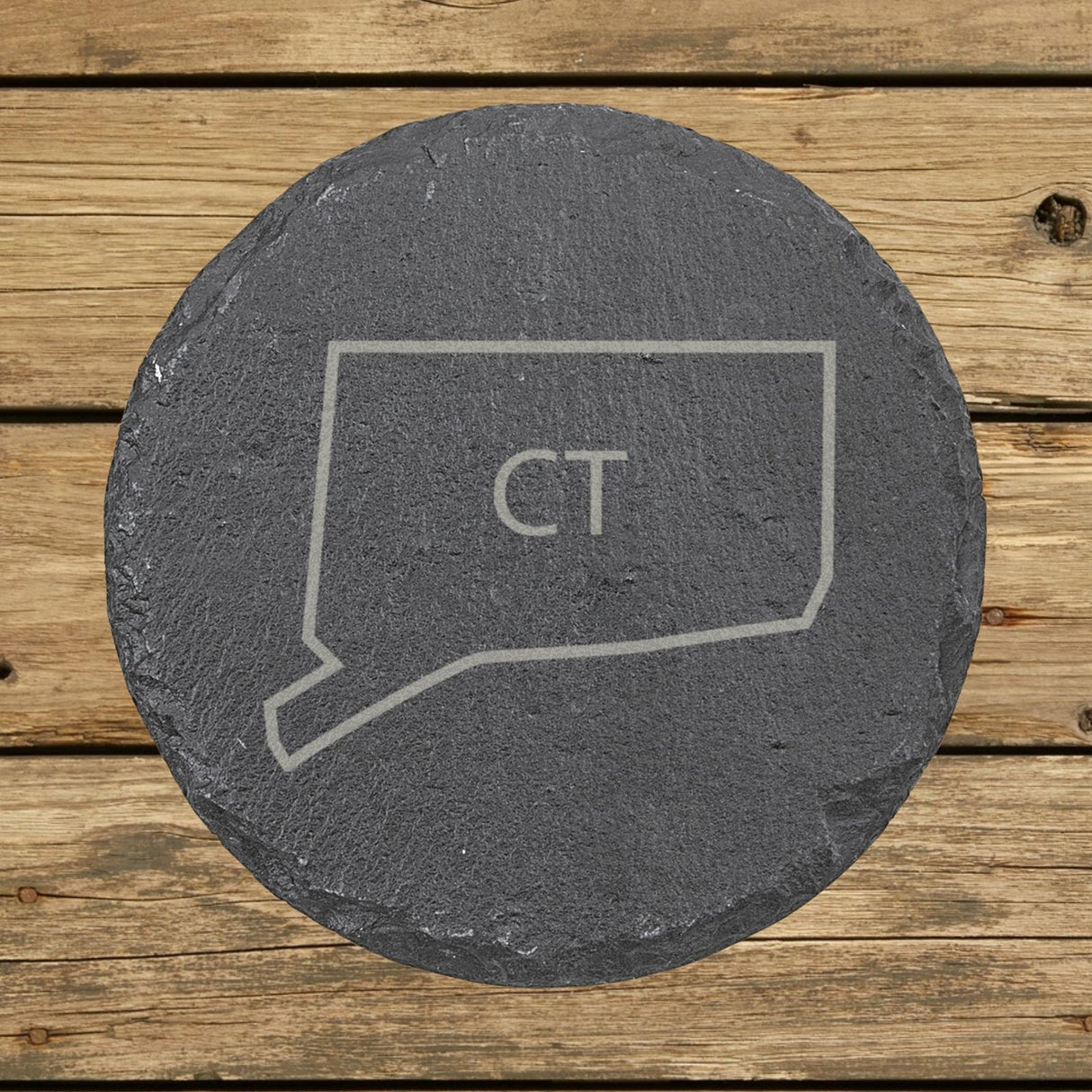 Connecticut round slate coaster engraved with the state outline and CT initials