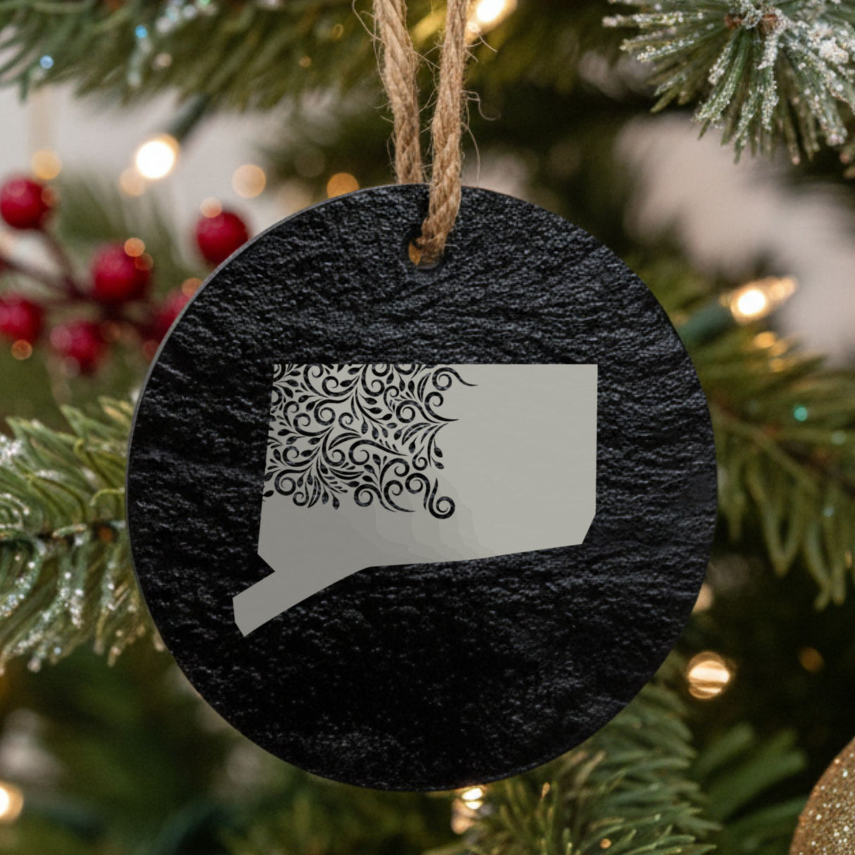 Connecticut round slate Christmas ornament engraved with the state shape in ornate floral scrollwork