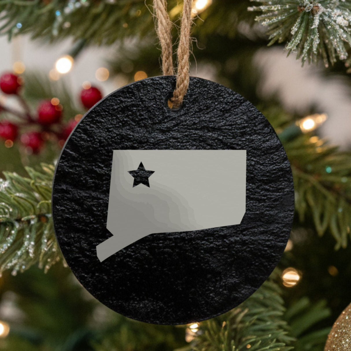 Connecticut round slate Christmas ornament engraved with the state shape and a star