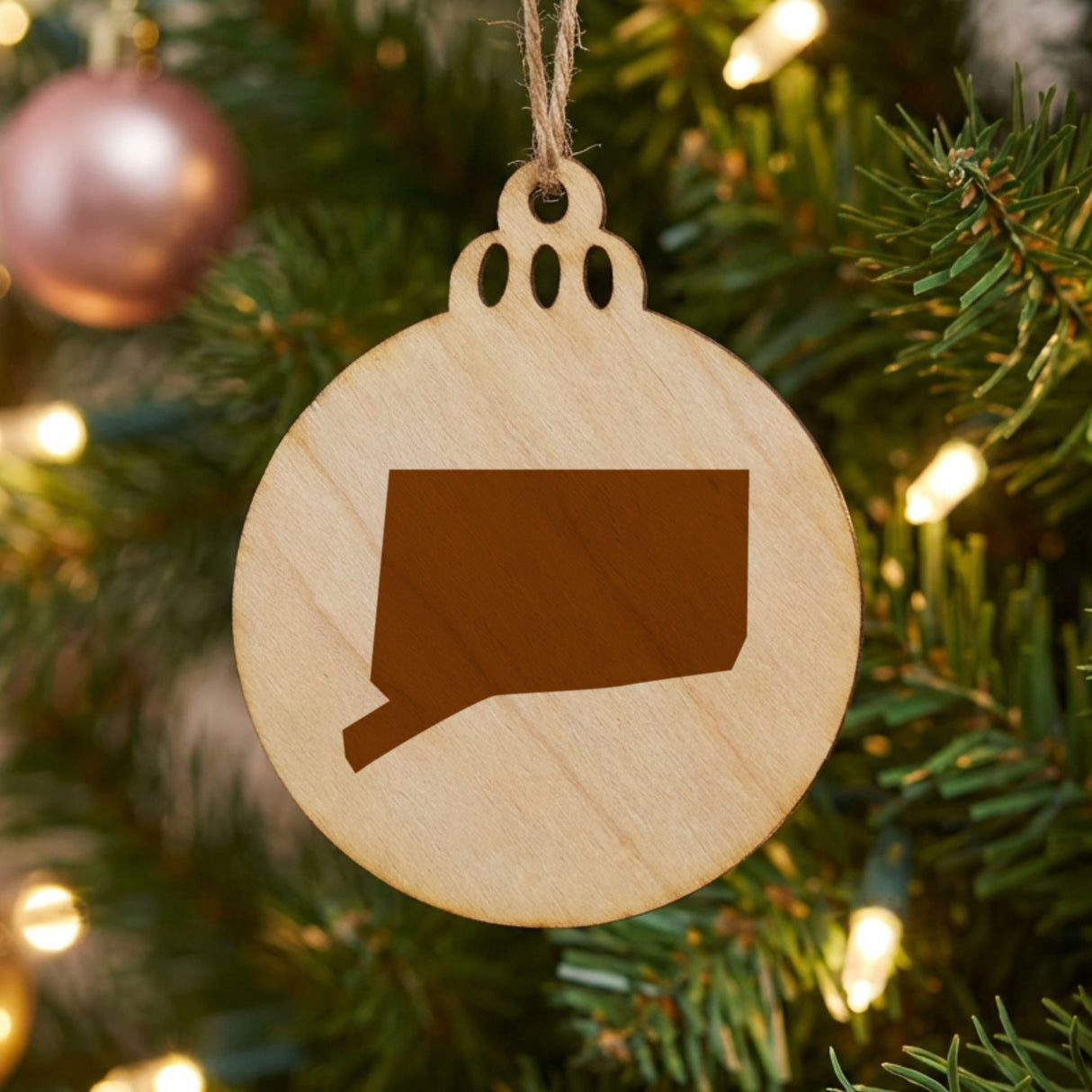 Connecticut round wood Christmas ornament with the full state shape engraved