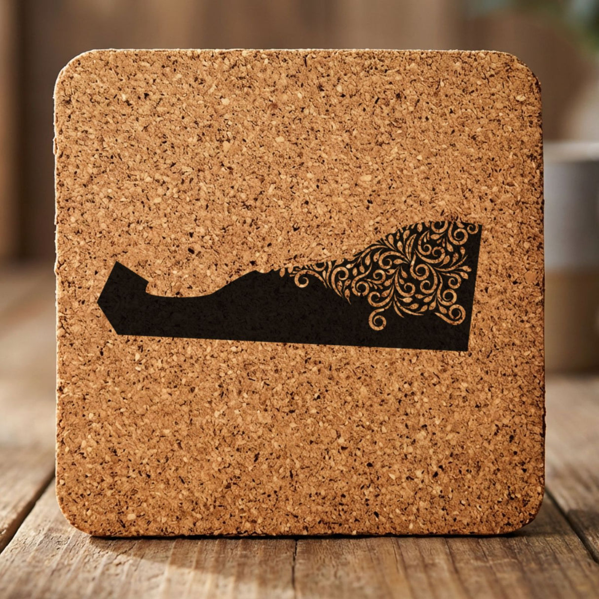 Delaware square cork coaster engraved with the state shape in ornate floral scrollwork
