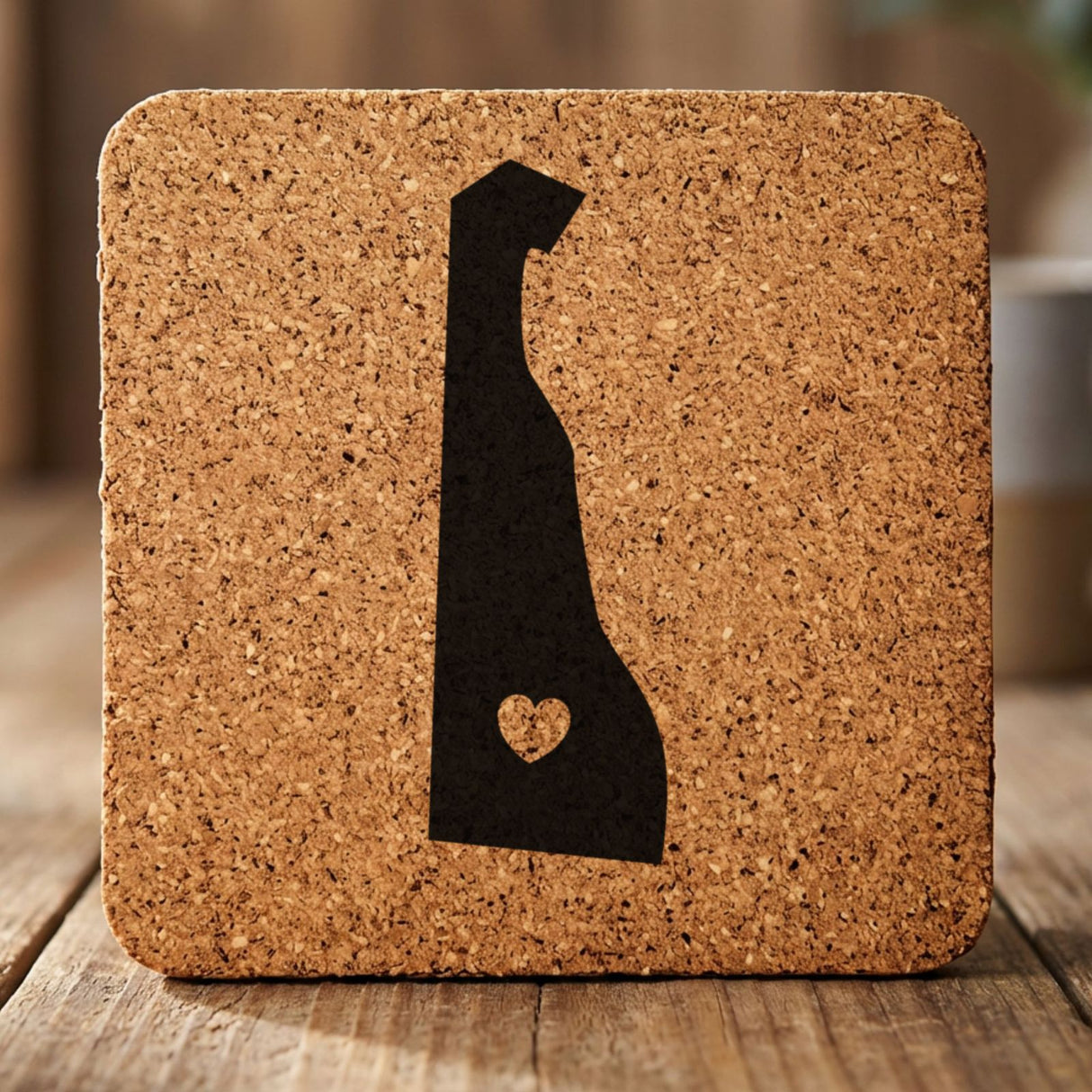 Delaware square cork coaster engraved with the state shape and a heart