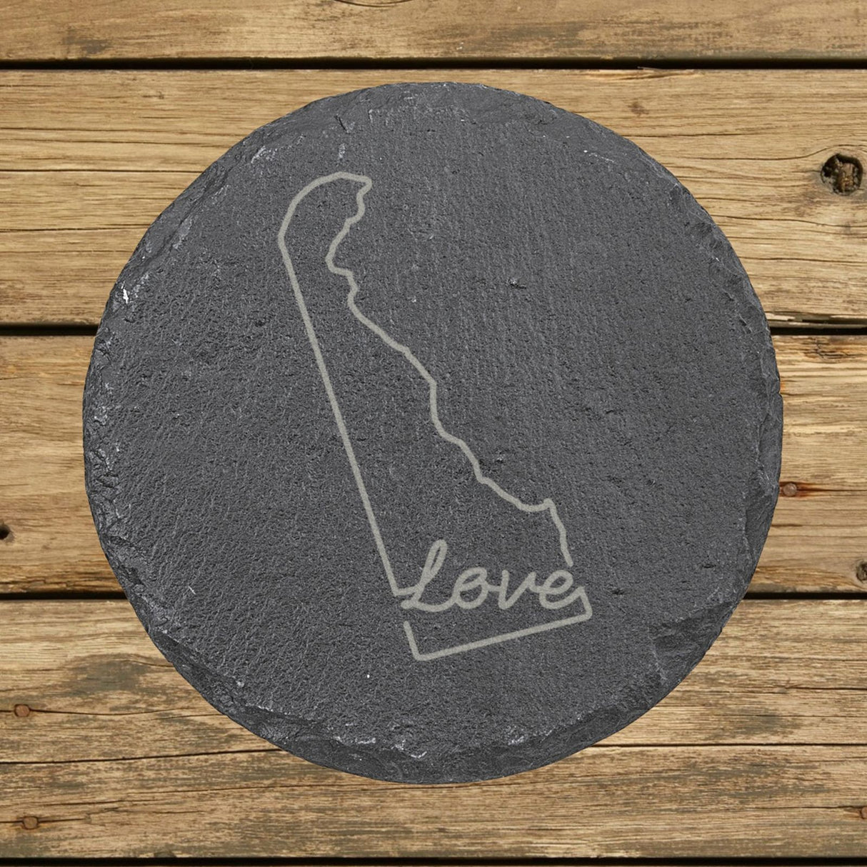 Delaware round slate coaster engraved with a hand-drawn state outline and love in cursive