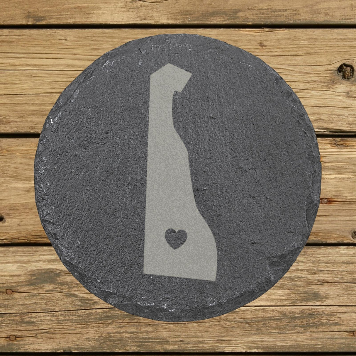 Delaware round slate coaster engraved with the state shape and a heart