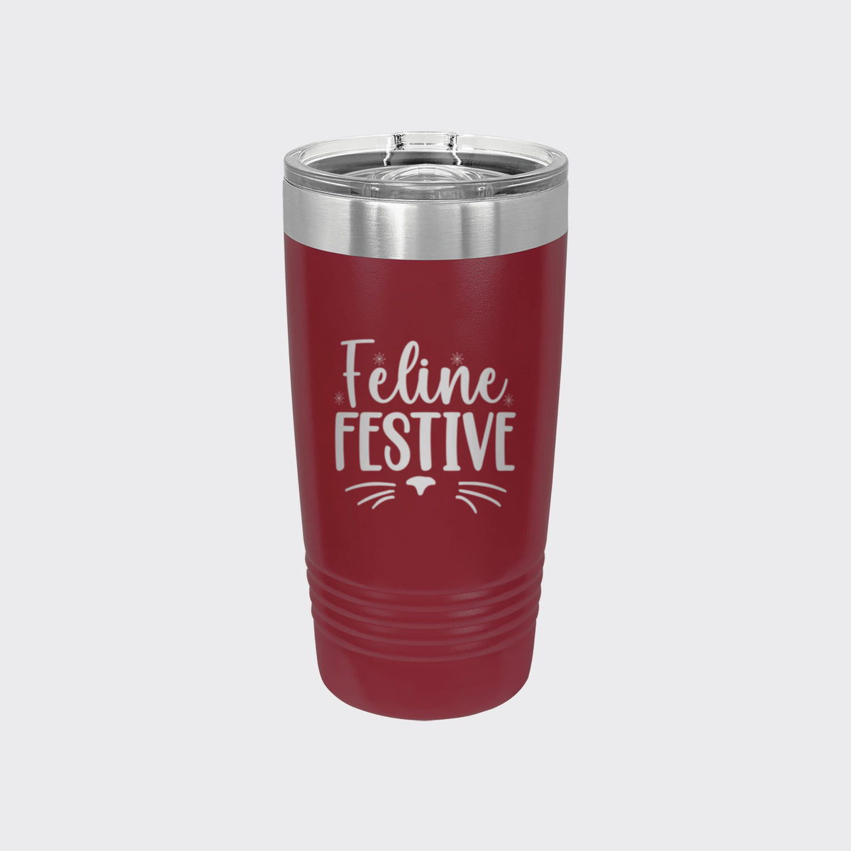 Maroon 20 oz tumbler laser engraved with "Feline Festive"
