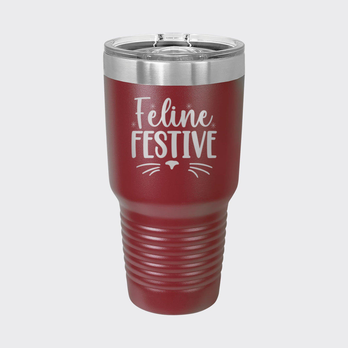 Maroon 30 oz tumbler laser engraved with "Feline Festive"