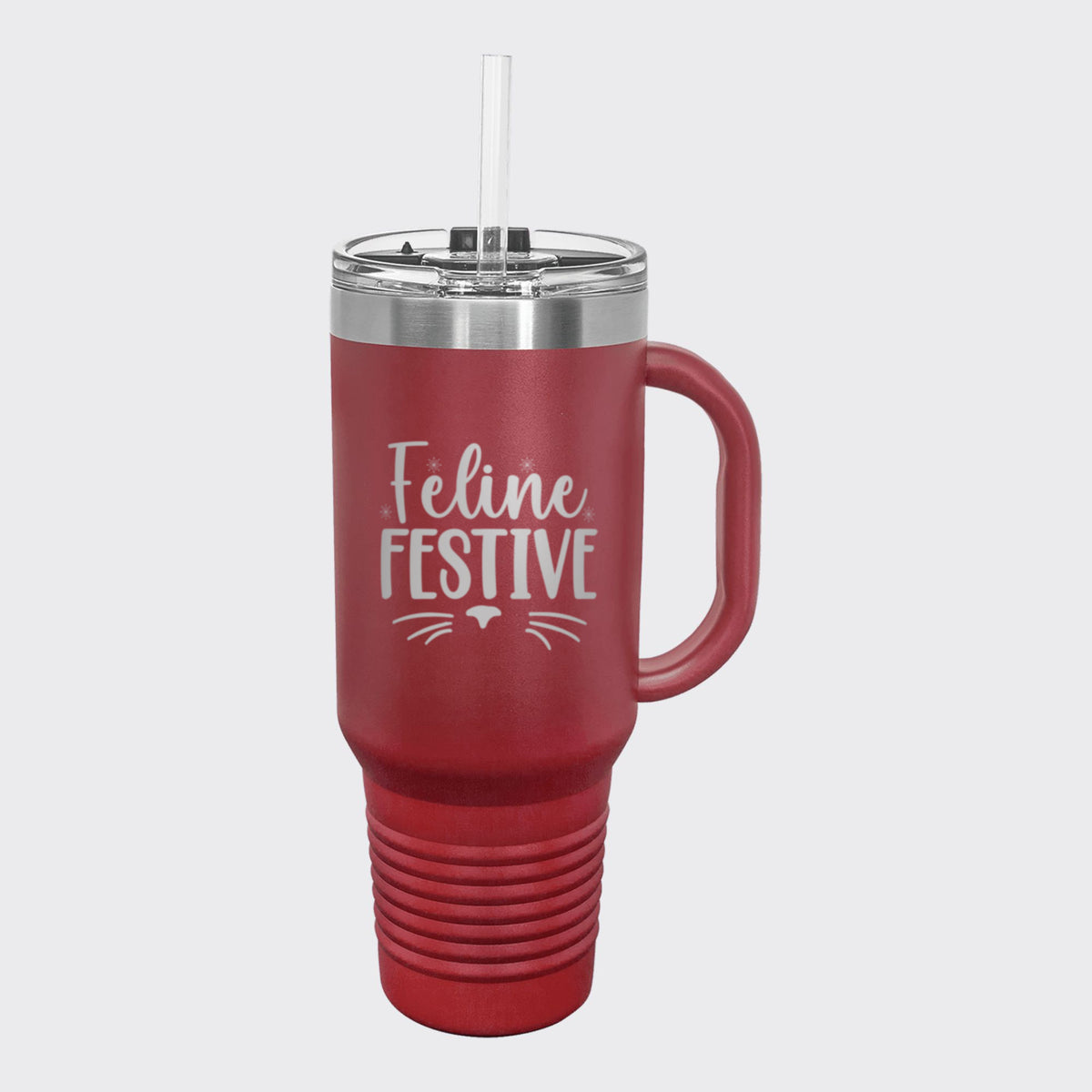 Maroon 40 oz tumbler with handle and straw laser engraved with "Feline Festive"