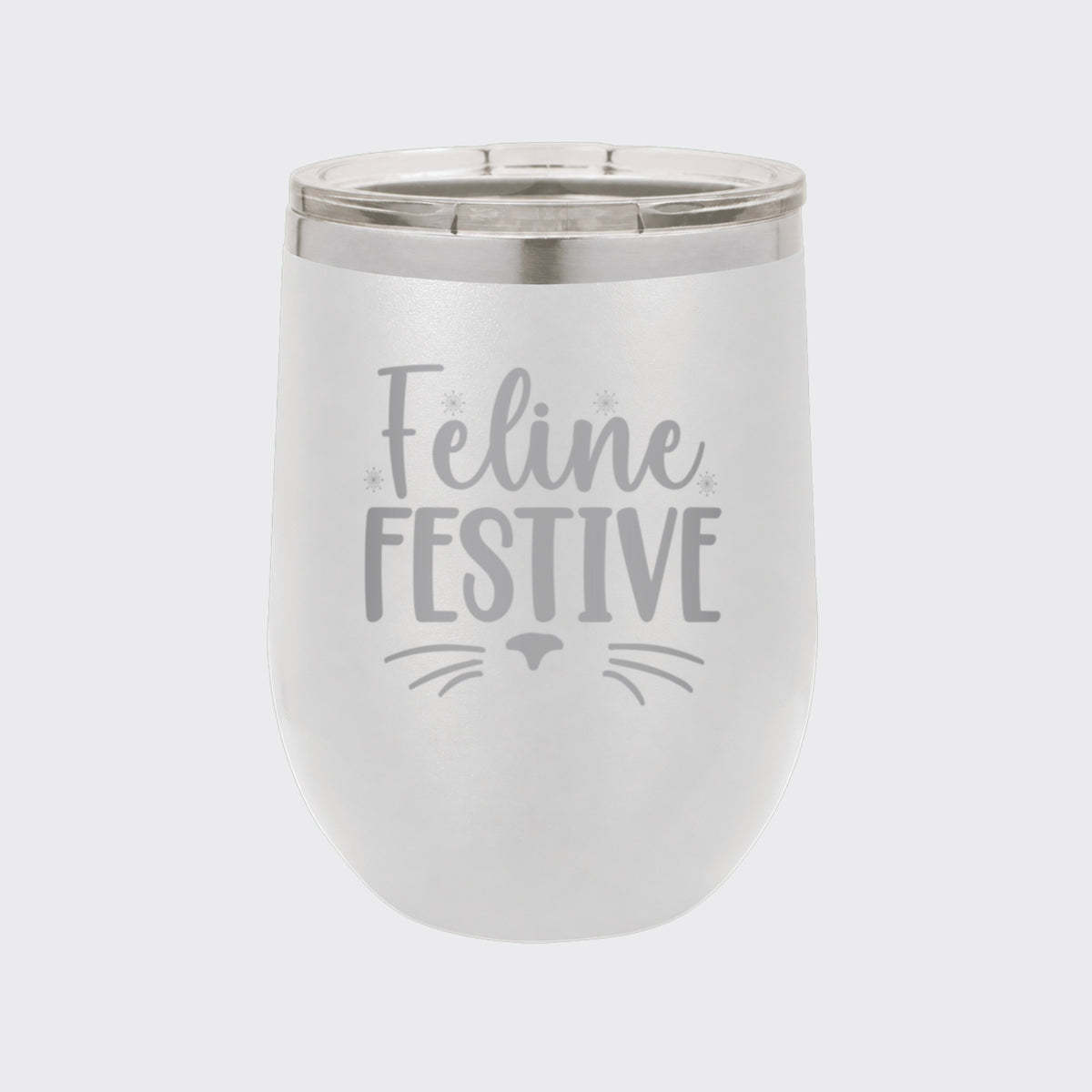 White 12 oz stemless wine tumbler laser engraved with "Feline Festive"