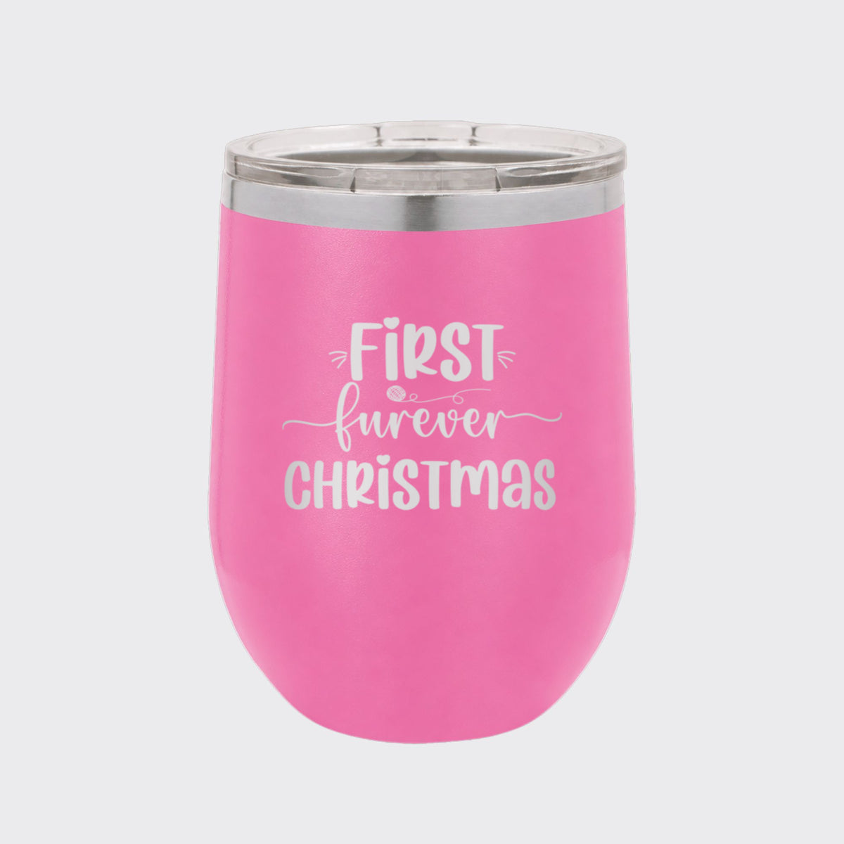 Pink 12 oz stemless wine tumbler laser engraved with "First Furever Christmas"