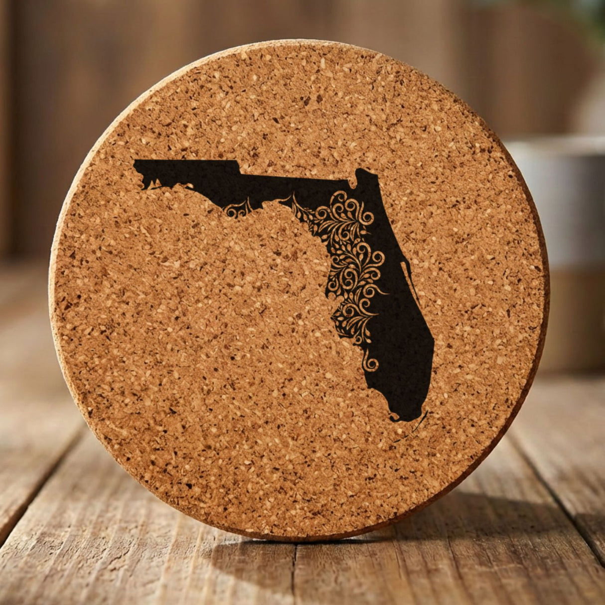 Florida round cork coaster engraved with the state shape in ornate floral scrollwork